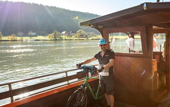 Crossing the Danube on small, local ferries