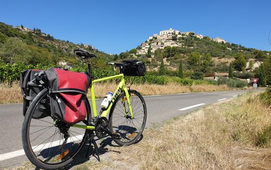 Cycling towards the hilltop village of Gordes