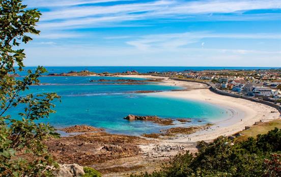 The azure blue waters of Cobo Beach
