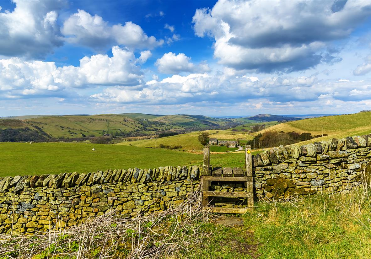 Traditional stone wall and stile on trail