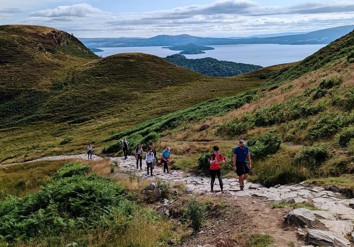 Walkers ascending up Conic Hill